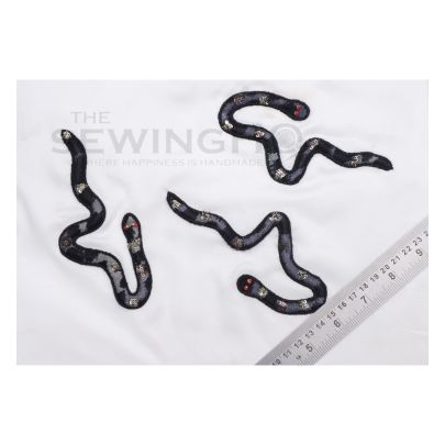 Amos Snake Embroidery - tulle lace fabric is appliquéd onto the base fabric