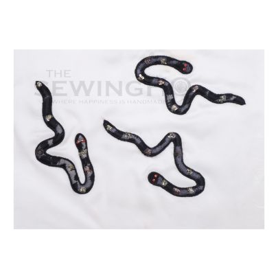 Amos Snake Embroidery - tulle lace fabric is appliquéd onto the base fabric