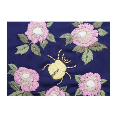 Ashton Bug Embroidery - characterised by its unique materials, natural hues, and dynamic appearance