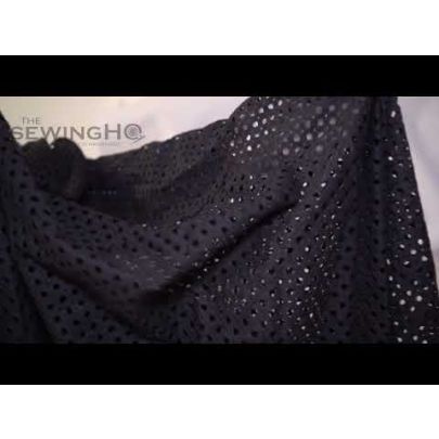 Black Punched Hole Cotton Lace - captivating pattern of punched holes adorning the fabric