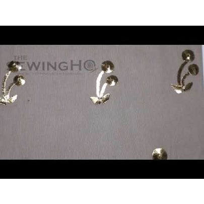 Alexia Embroidery - metal wires are used to create this gold cherry embellishment