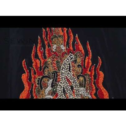 Anisa Fire Embroidery - a fiery beaded embellishment that depicts a masterpiece of art